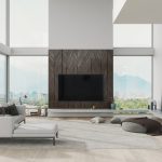 Interior of a contemporary loft living room with beautiful mountain, ocean and beach view.